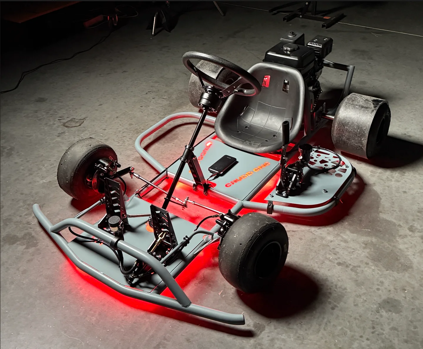 Completed Dad Drift Kart with grey frame and red lighting