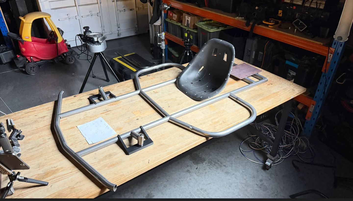 Tack-welded tube frame with seat positioned on the workbench