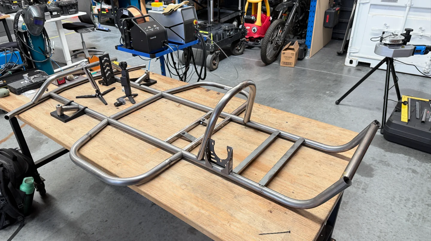 Tube frame with front mounting points, seat rails and rear engine guard